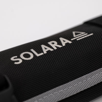 Black bag with 'SOLARA' logo on a light gray background