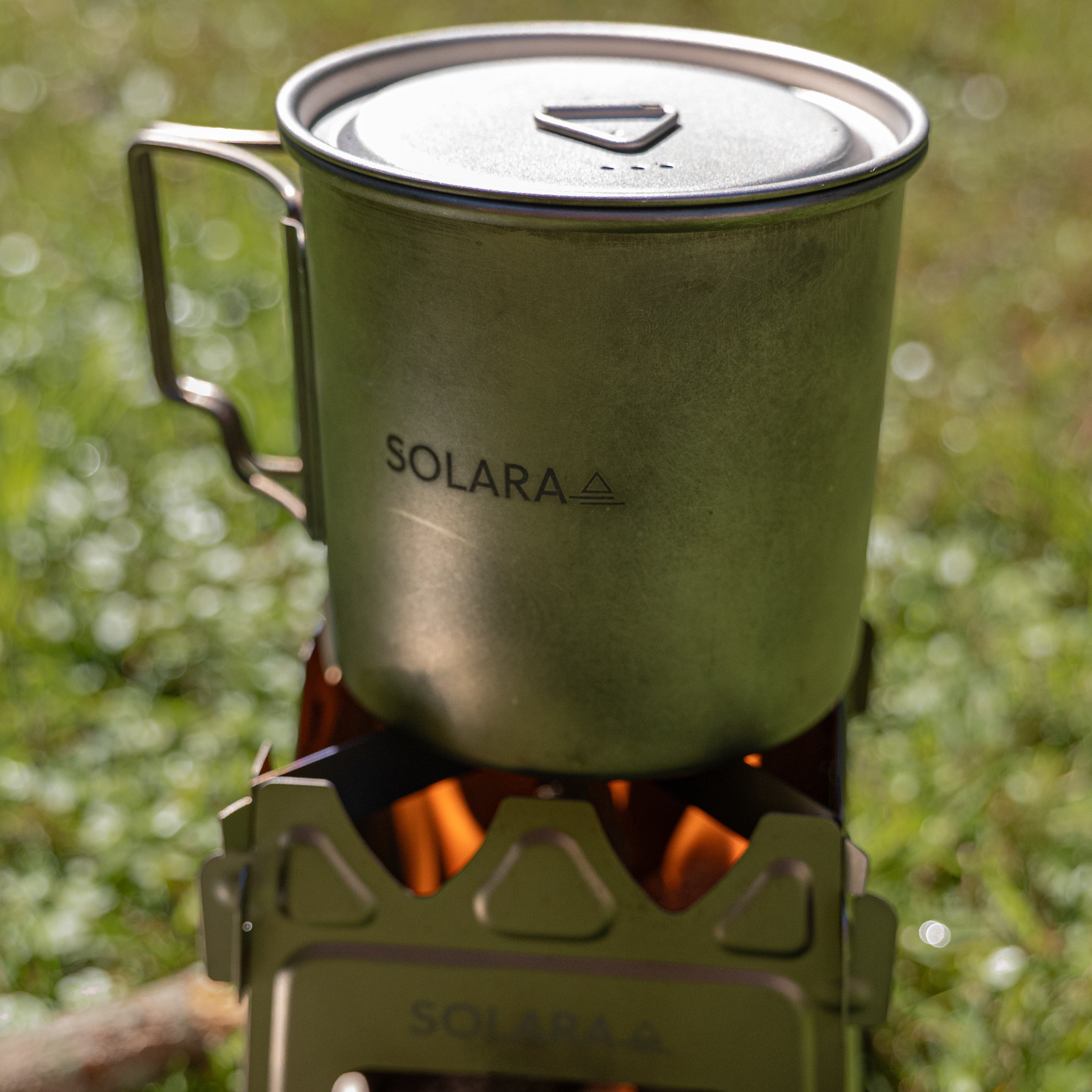 SOLARA camping stove with a pot on a natural background