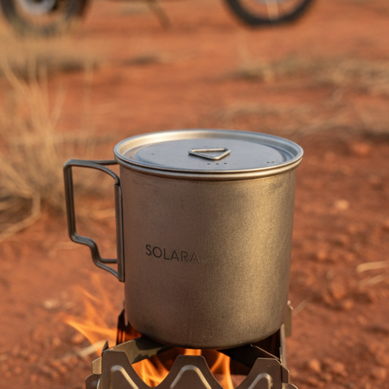 SOLARA mug on a portable stove with a motorcycle in the background